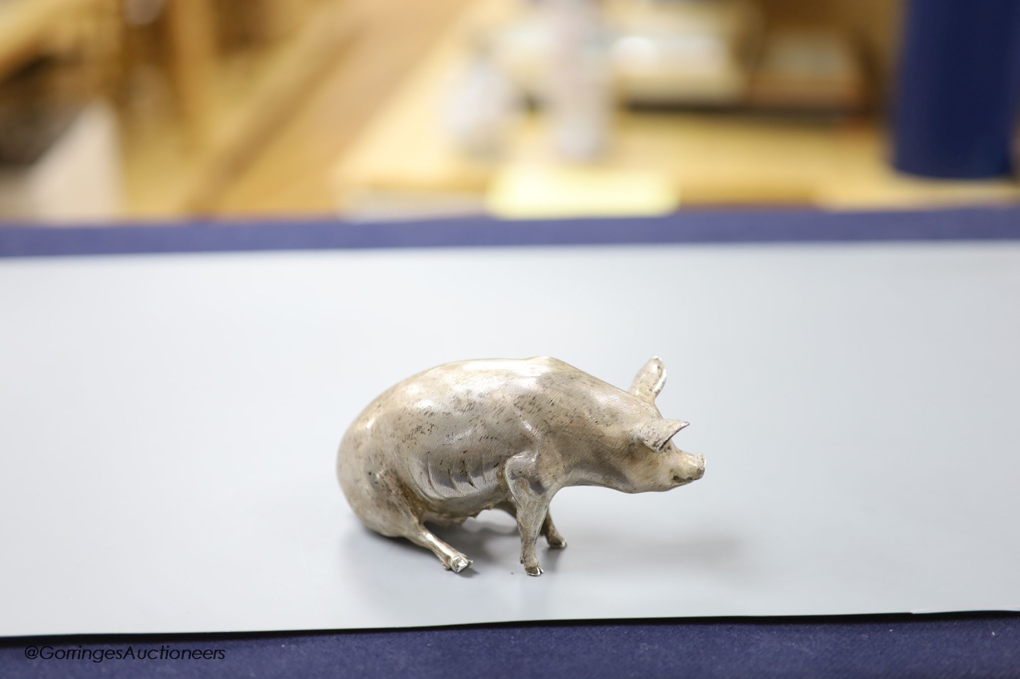 A modern silver miniature model of a seated pig, C.F.H & Co, London, 1993, height 65mm, 302 grams.